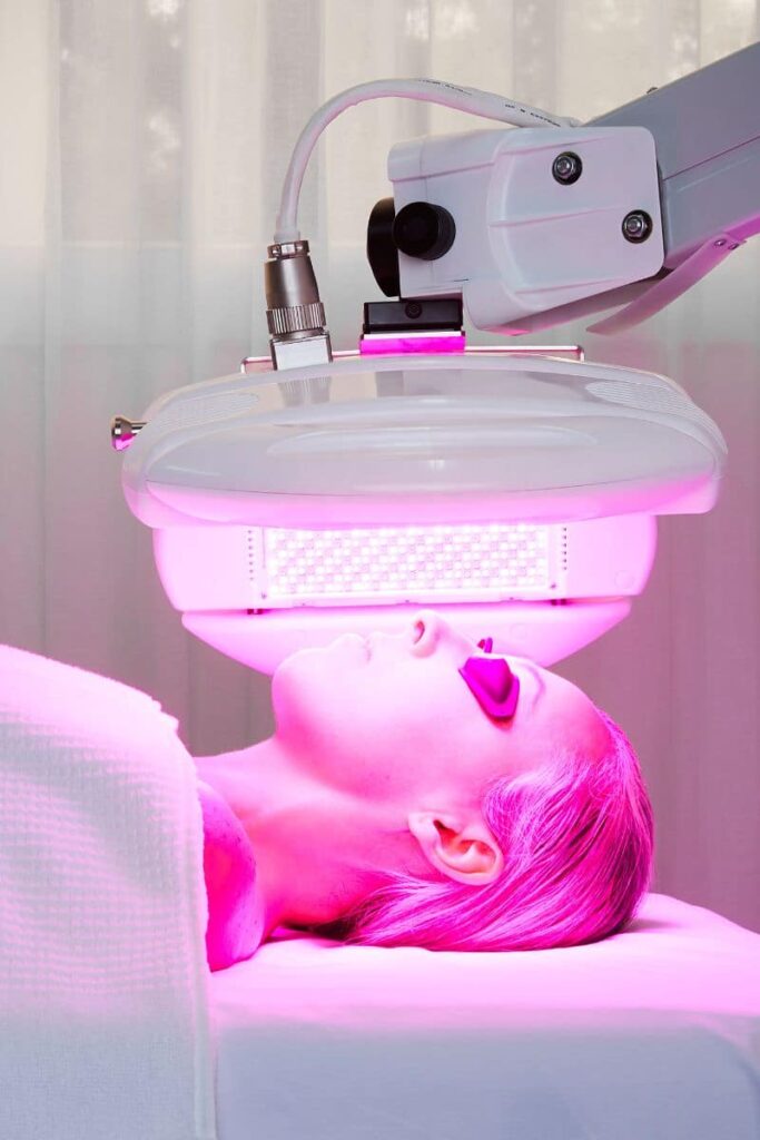 Woman having dermalux led tri-wave md treatment